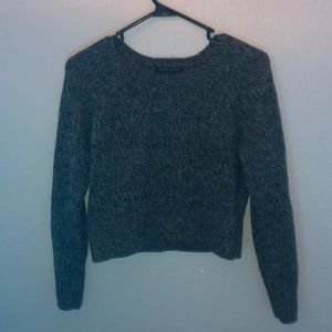 A grey and black sweater